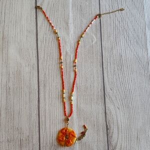 Beaded unique Chinese orange necklace with dragon pendant.